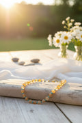 Infuse your style with radiant, sun-kissed energy with this meticulously handcrafted genuine gemstone statement necklace.