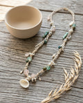 Macrame Beaded Necklace — Coastal Lifestyle Still Life | Generated by Modelize